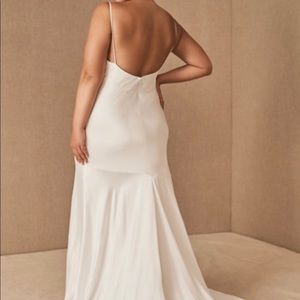 Wedding dress with a wedding cape (not shown) that has never been worn.